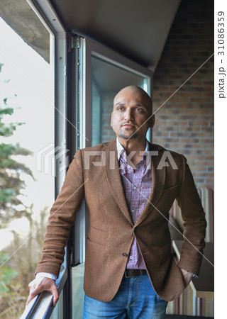 Portrait of happy handsome indian business man 31086359