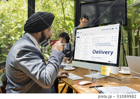 Man composing an email on a digital device Man composing an email on a digital device 31089982