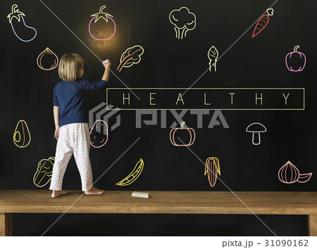 Little girl writing on blackboard about vegetable healthy food icon Little girl writing on blackboard about vegetable healthy food icon 31090162