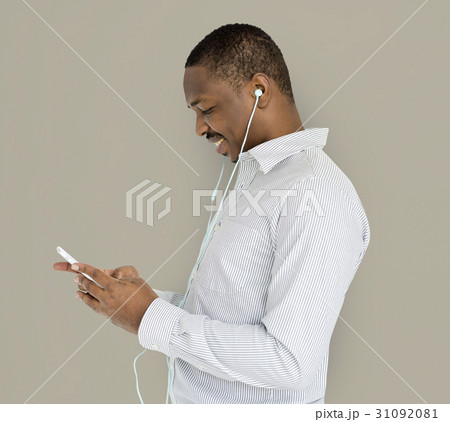 African Descent Man Listening Music 31092081