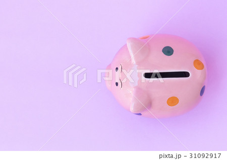 Closeup top view pink ceramic piggy bank on pink 31092917