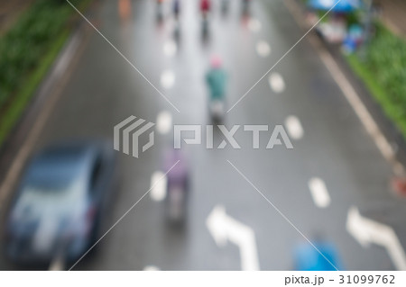 Undefined motorcycle traffic in rain 31099762