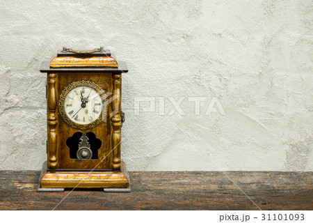 still life of antique clock on woolden plank still life of antique clock on woolden plank 31101093