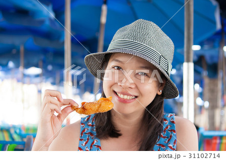 Woman eating seafood Woman eating seafood 31102714