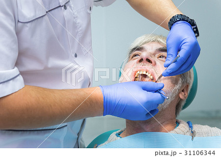 Senior patient at the dentist. Senior patient at the dentist. 31106344
