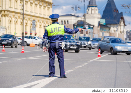 Traffic policeman works on a street at day time 31108519