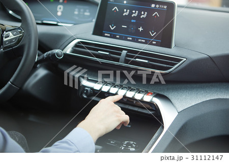 Woman using car buttons system 31112147