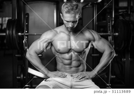 Caucasian sexy fitness model in gym close up abs. Caucasian sexy fitness model in gym close up abs. 31113689