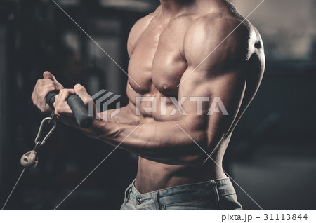 Handsome power athletic man on diet training pumping up muscles Handsome power athletic man on diet training pumping up muscles 31113844