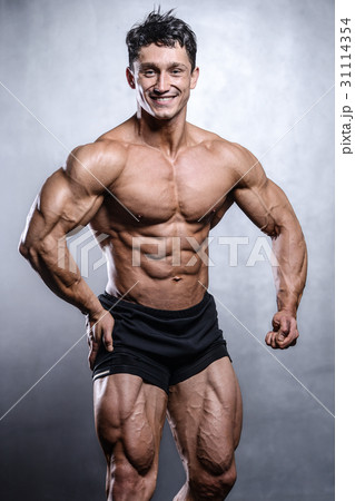 Caucasian sexy fitness model in gym close up abs. Caucasian sexy fitness model in gym close up abs. 31114354