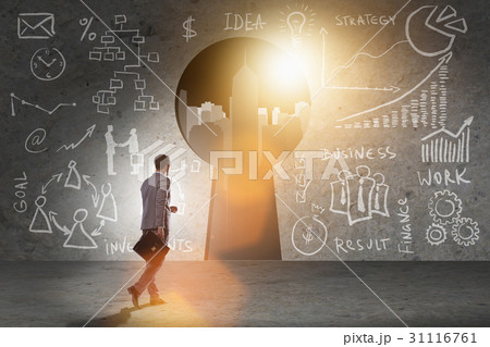 Businessman walking towards keyhole in business 31116761