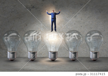 Businessman in new idea concept with light bulb 31117415