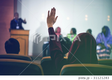 Businesswoman hand raised for asking the question in the conference 31121283