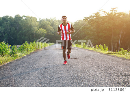 man running and jogging on road 31123864