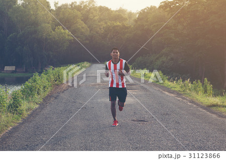man running and jogging on road man running and jogging on road 31123866