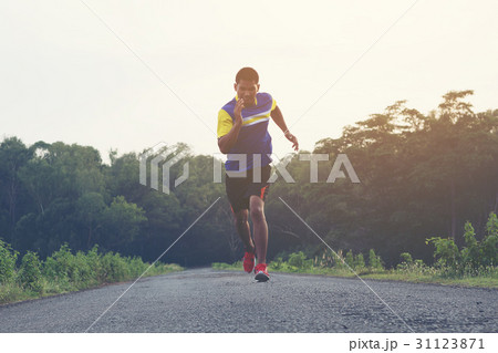 man running and jogging on road 31123871