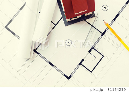 close up of house model on architectural blueprint 31124259
