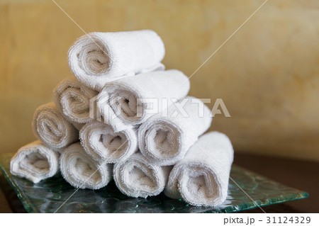 rolled bath towels at hotel spa 31124329