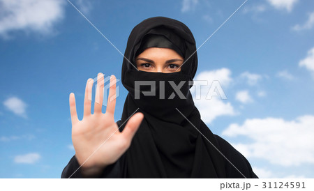 muslim woman in hijab showing stop sign muslim woman in hijab showing stop sign 31124591