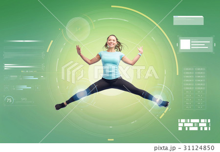 happy smiling sporty young woman jumping in air happy smiling sporty young woman jumping in air 31124850