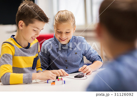 happy children building robots at robotics school happy children building robots at robotics school 31126092