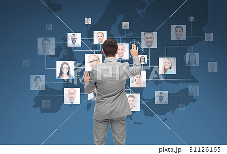 businessman using virtual screen with contacts 31126165