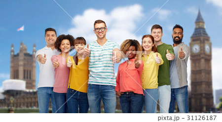 happy people showing thumbs up over london 31126187