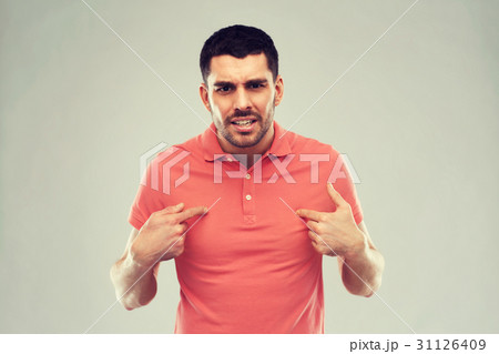 angry man pointing finger to himself over gray 31126409