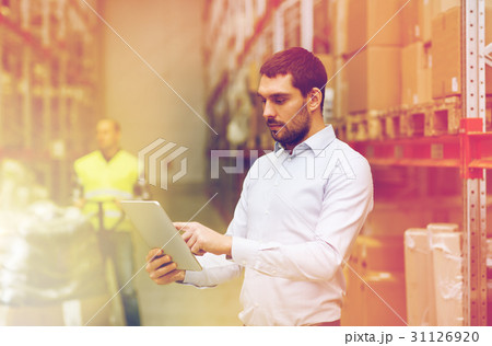 businessman with tablet pc at warehouse businessman with tablet pc at warehouse 31126920