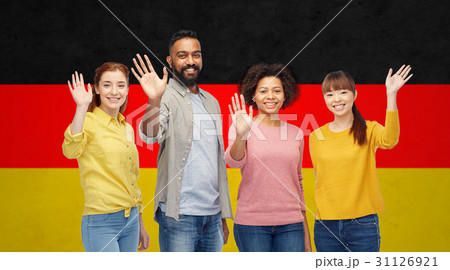 international group of happy people waving hands 31126921