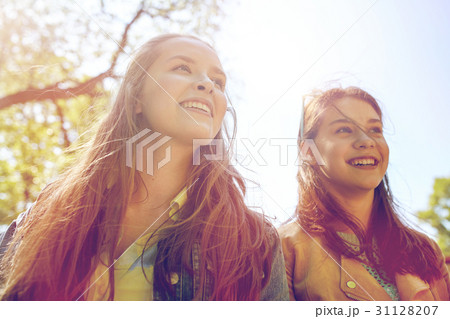happy teenage student girls or friends outdoors 31128207