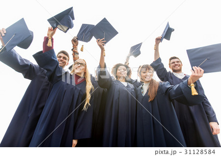 happy students or bachelors waving mortar boards happy students or bachelors waving mortar boards 31128584