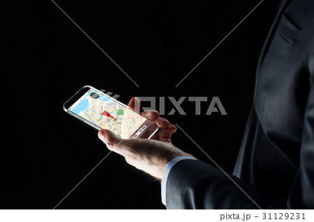 close up of businessman with gps map on smartphone 31129231