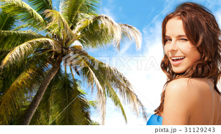 happy smiling woman winking over summer beach 31129243