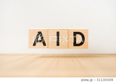 floating wooden cube with word on wood floor 31130309