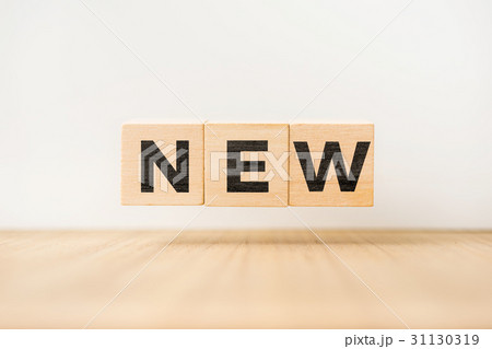 floating wooden cube with word on wood floor 31130319