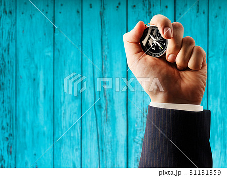 Compass in male hand Compass in male hand 31131359