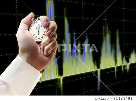 Candlestick chart graphic and stopwatch in hand Candlestick chart graphic and stopwatch in hand 31131491