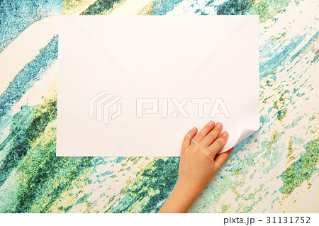Child's hand turning over paper Child's hand turning over paper 31131752