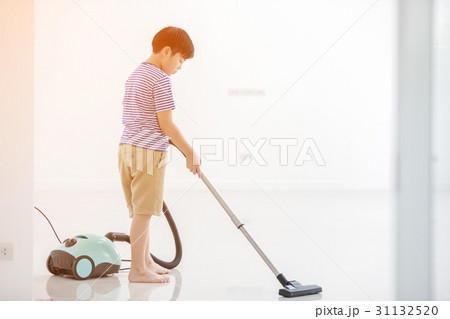 Happy asian child cleaning in the house Happy asian child cleaning in the house 31132520