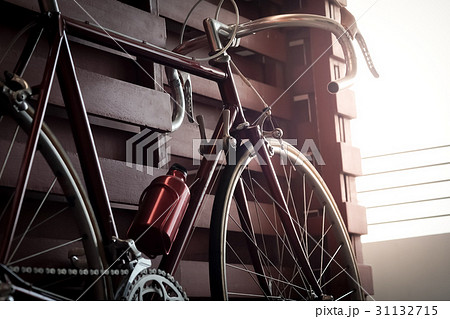 Bicycle leaning against the wall fence in the dark 31132715