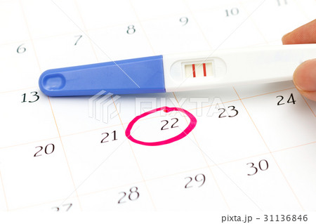 Pregnancy test with positive result on calendar Pregnancy test with positive result on calendar 31136846