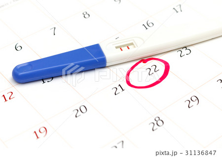 Pregnancy test with positive result on calendar 31136847