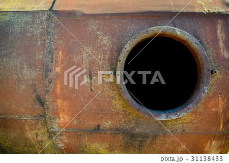opened rusty manhole on orange fuel tank 31138433