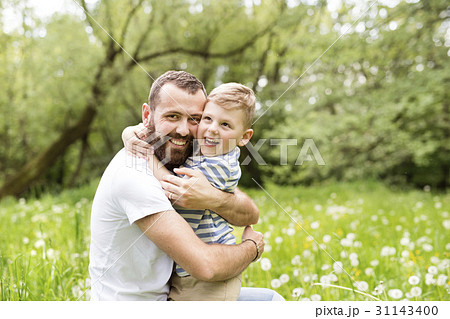 Young father with little boy, sunny spring day. 31143400