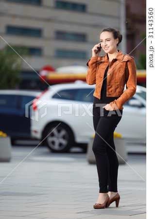 Fashionable woman calling phone 31143560