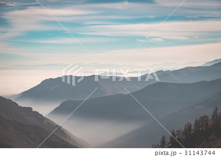 Distant mountain range with fog and mist 31143744