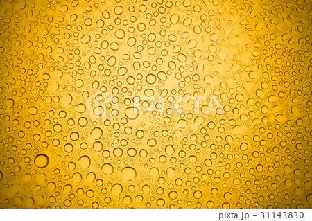 Water drops on yellow glass. Water drops on yellow glass. 31143830