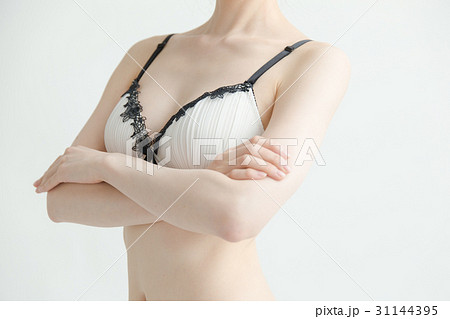 下着姿の女性 白バックの写真素材