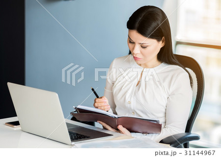 Serious confident business lady recording Serious confident business lady recording 31144967